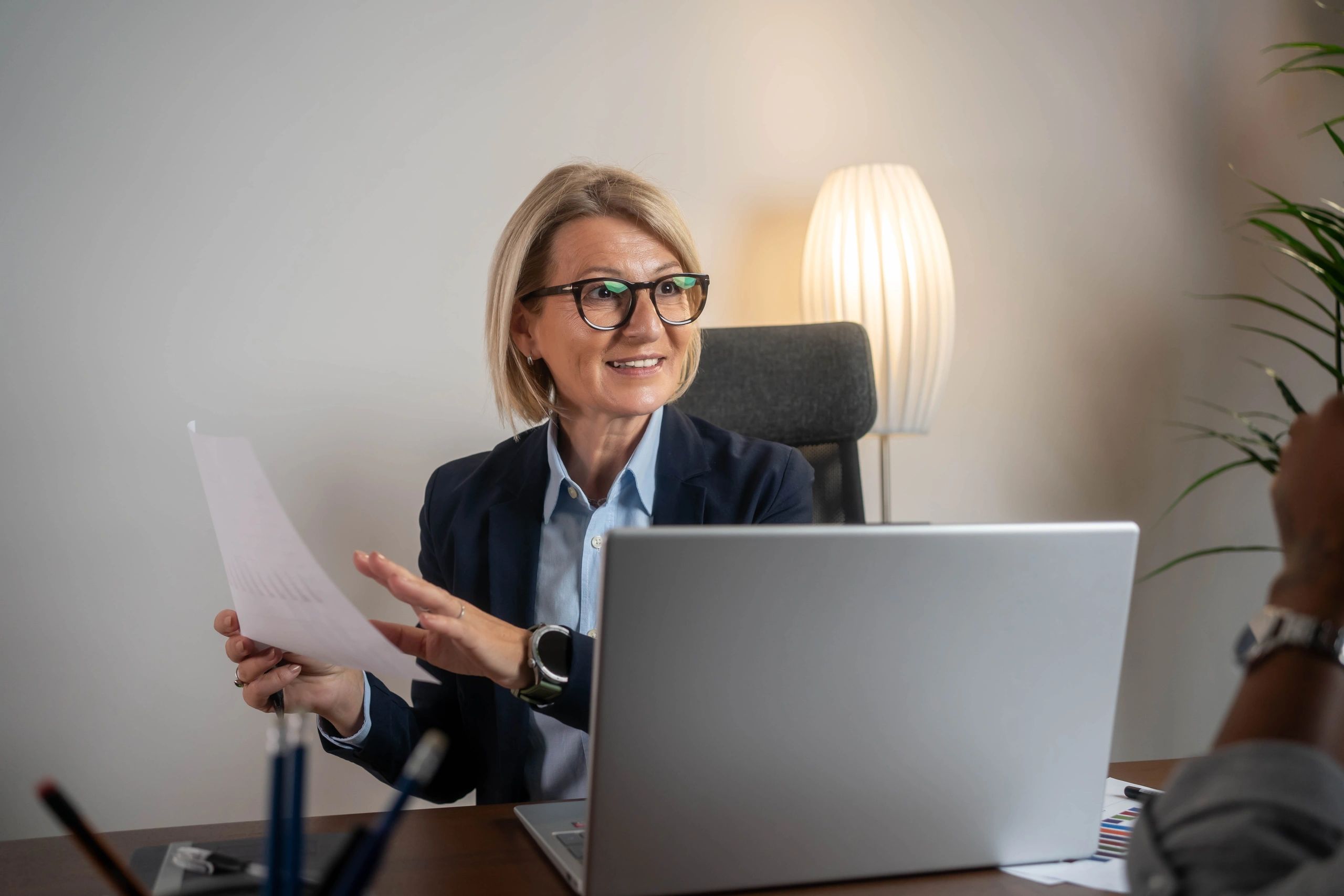 Advisor reviewing paperwork in a professional office